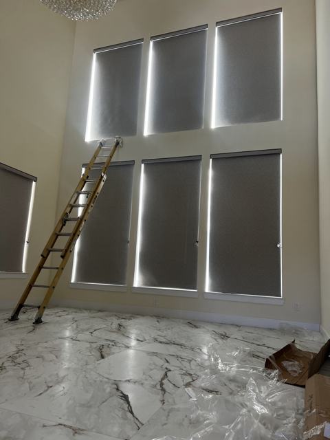 Roller shades on two-story windows