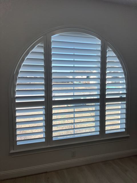 Large arched-top plantation shutters